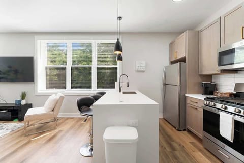 Modern kitchen setup w/ spacious counters ready for any meal.