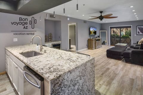 Spacious open-concept living with modern furnishings and plenty of seating for the whole family. Modern living room with flat-screen TV and contemporary decor