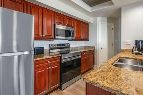 Cook with ease in a full kitchen with granite counters.