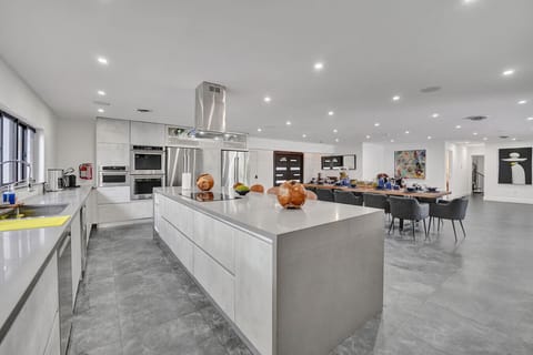 Gourmet Kitchen with Dual Ovens, Two Refrigerators, Breakfast Bar with Seating for Five