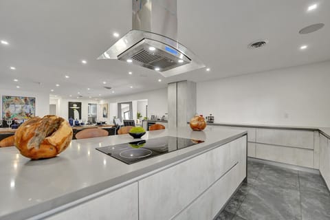 Gourmet Kitchen with Dual Ovens, Two Refrigerators, Breakfast Bar with Seating for Five