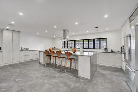 Gourmet Kitchen with Dual Ovens, Two Refrigerators, Breakfast Bar with Seating for Five