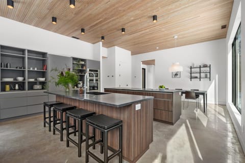 Chef-inspired kitchen featuring premium Miele appliances and sleek modern lines.