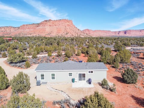 Towering red rock cliffs to the North