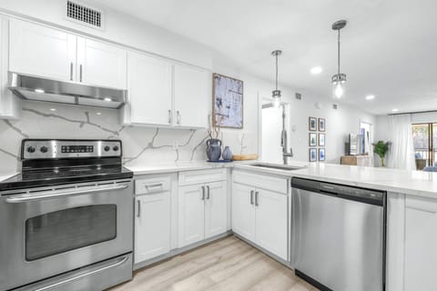 Open kitchen design connects effortlessly to the living space, creating a bright and welcoming atmosphere.