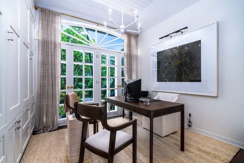 The office/workspace, adjacent to the living room.