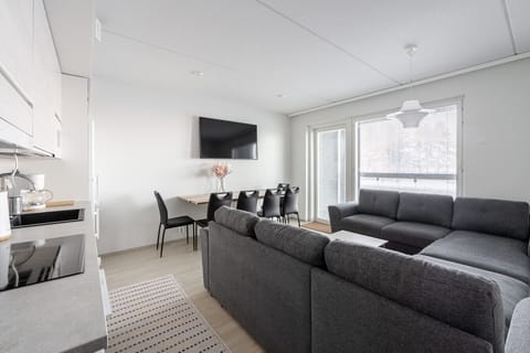 A bright and inviting open-plan living space, designed for comfort and socializing.