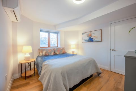 Queen size bed and custom pocket doors for this relaxing bedroom retreat.