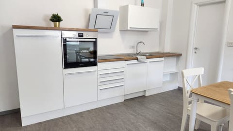 KItchen - oven, stove top, dining table