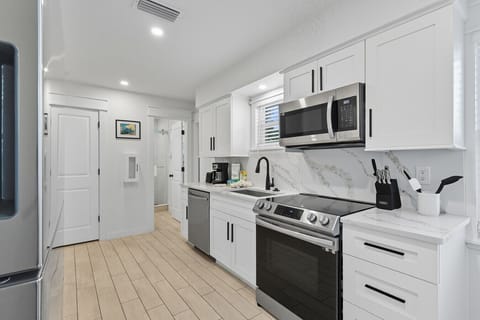 fully stocked galley kitchen in front facing unit