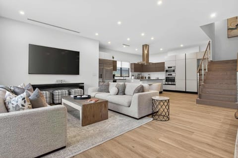 Living area with natural sunlight and Smart TV
