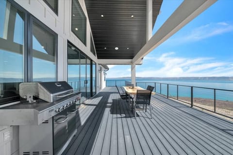 Private deck overlooking Bear Lake with grill and outdoor seating