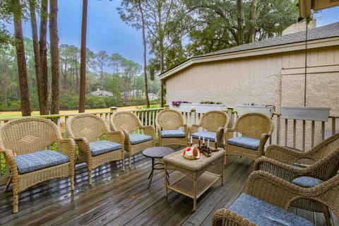 Step out onto the back deck to find a spacious seating area that overlooks the 14th fairway of the Club Course.