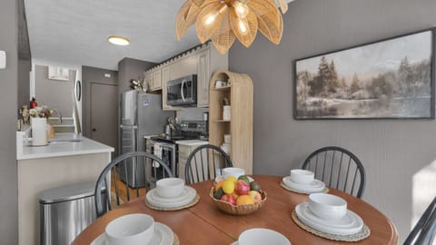 Gather around the dining table, conveniently located next to the kitchen—ideal for family meals and memorable moments.