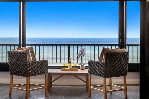 Take in breathtaking oceanfront views and the soothing sounds of the waves from your private lanai.