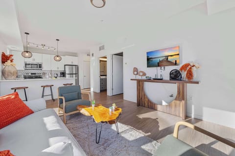 Enjoy an open layout that connects the kitchen and living area seamlessly. This setup is ideal for socializing, relaxing, or multitasking, making the space feel larger and more enjoyable for daily living.