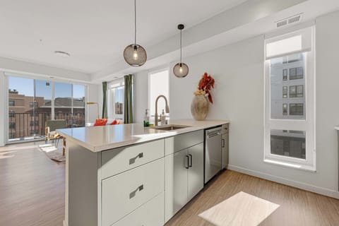 Enjoy an open kitchen that flows seamlessly into the living area, perfect for cooking, socializing, or working remotely. The bright layout makes daily routines feel easy and keeps the space feeling open and inviting.