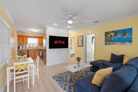 The entrance way to Living room with open dining 