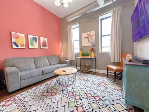 Modern living room with colorful decor.