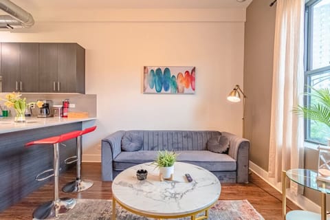 Bright, cozy, and modern! This stylish space features a comfortable lounge area, natural light, and a sleek kitchen bar — perfect for relaxing or working during your stay.