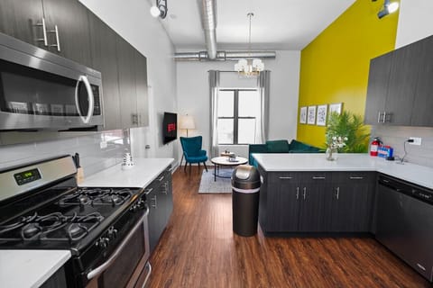 Open-concept living with a fully equipped kitchen and stylish lounge area