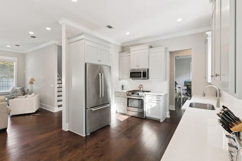 Your modern kitchen flows seamlessly into the living area, perfect for cooking while staying connected with your travel companions.