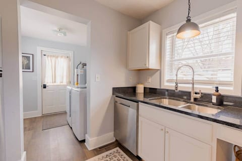 Kitchen looking onto laundry room and back door