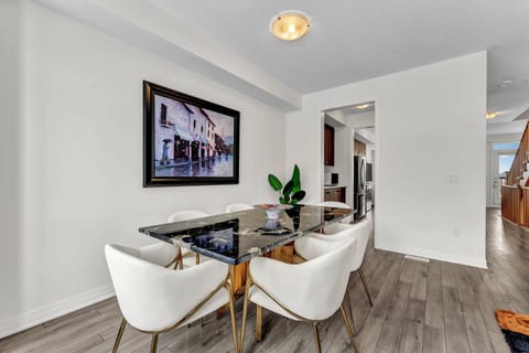 Another angle of the dining area and kitchen entryway