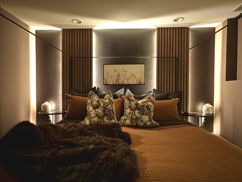 The Primary Suite: A plush King bed and subtle Western character for a restful night.