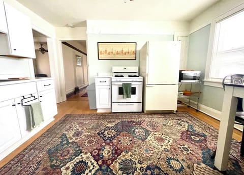 Full kitchen with gas stove, refrigerator, and space to prepare and enjoy meals.