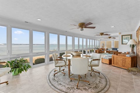 Sunroom Retreat: Brighten your days with stunning water views and elegant decor!
