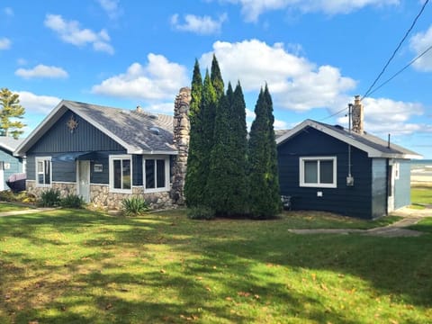 Inviting Exterior | Blue Siding, Stone Details & Open Lawn