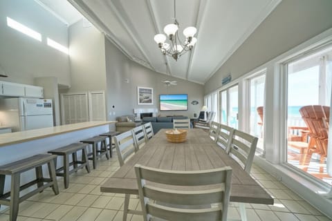 Gather in a luminous space where vaulted ceilings and panoramic gulf views create an unforgettable coastal ambiance.