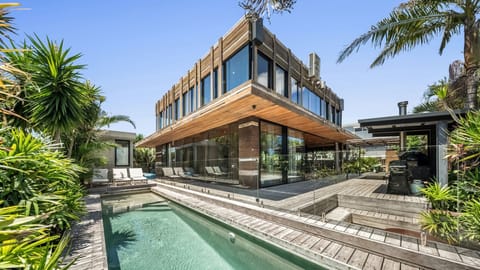 Private pool and spacious outdoor area surrounded by tropical greenery.
