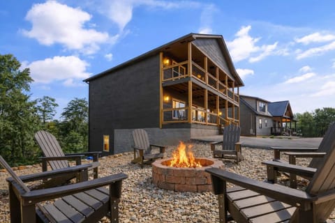 Gather around the fire pit in Adirondack chairs and enjoy cozy evenings with the home glowing warmly behind you in the Smoky Mountains.