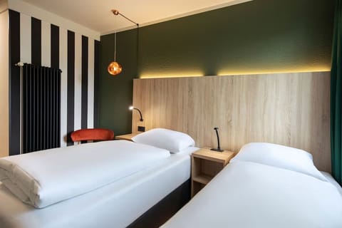 Settle into spotless twin beds for deep, quiet sleep.