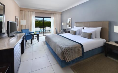 Wake refreshed in crisp linens with terrace light pouring in.