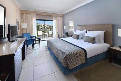 Drift off in a tranquil king room with balcony views.