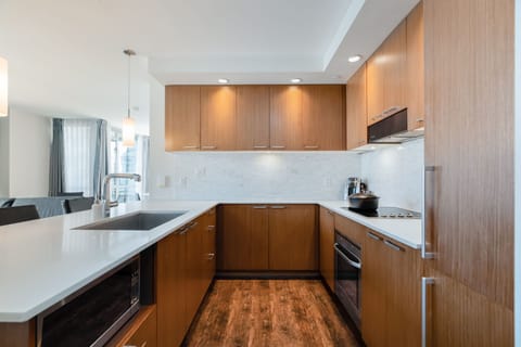 Enjoy culinary adventures in the well-appointed kitchen, which boasts elegant cabinetry, high-end appliances, and a functional layout.