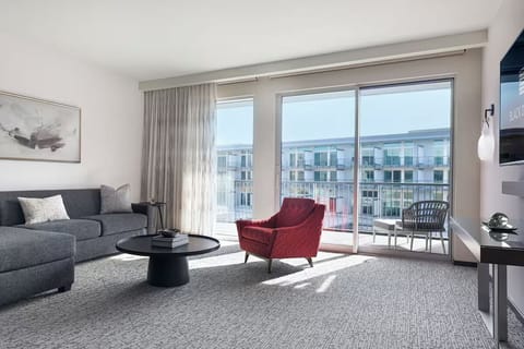 Lounge in sunlit comfort and step onto the private balcony.