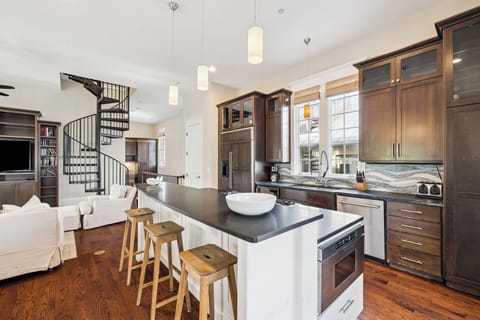 Your spacious kitchen features premium appliances, elegant pendant lighting, and a welcoming island where you'll love preparing meals together.