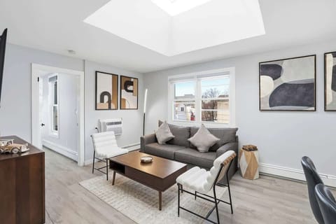 Light-filled living space with a skylight that brings in abundant natural light, creating an airy and inviting atmosphere.
