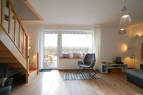 Relax in this bright living room with direct access to the terrace - your retreat!