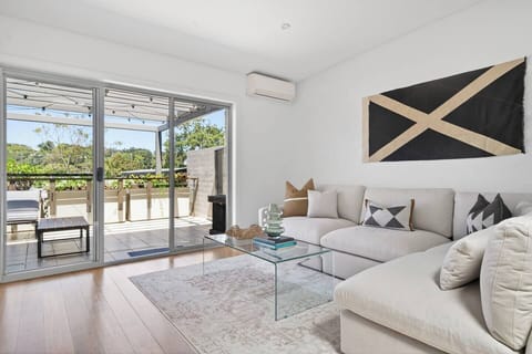 Slide open the doors and extend your living outdoors to the expansive private terrace with open scenic views.