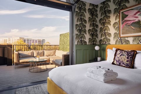 A seamless indoor-outdoor escape. Wake up to soft morning light and step right onto your private rooftop lounge.