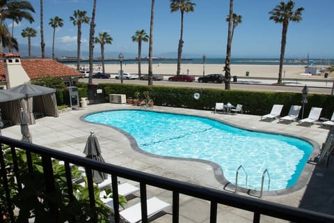 Dive into sparkling pool days with ocean breezes nearby.