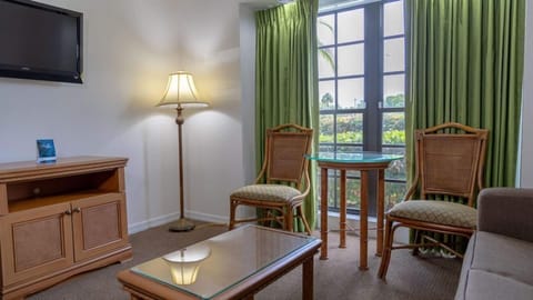 Relax with coffee by sunny windows in a cozy lounge.