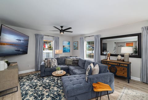 Living Room with tv, piano, and  games,