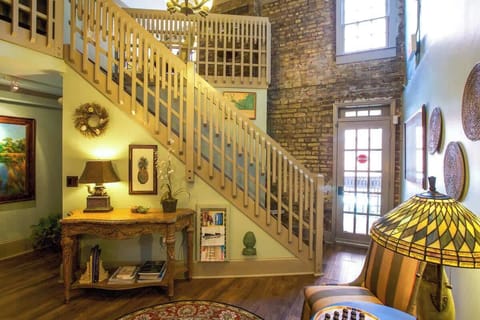 Beautifully decorated 2nd Floor Foyer with Outdoor Patio. Staircase leads to 3rd Floor Studio 
