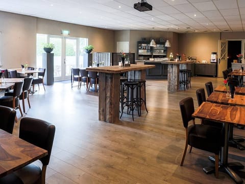 Sip and mingle in a bright bar area made inviting.